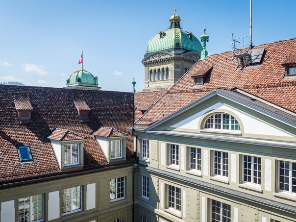 View of the Federal Palace dome beyond the rooftops of the Berne head office.